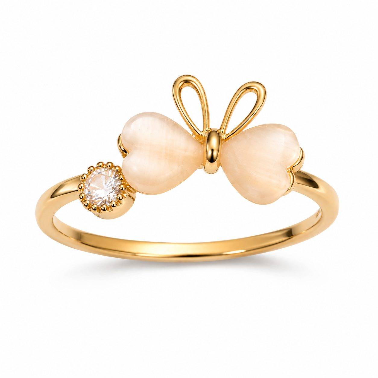 gold-colored ring features a white enamel butterfly design