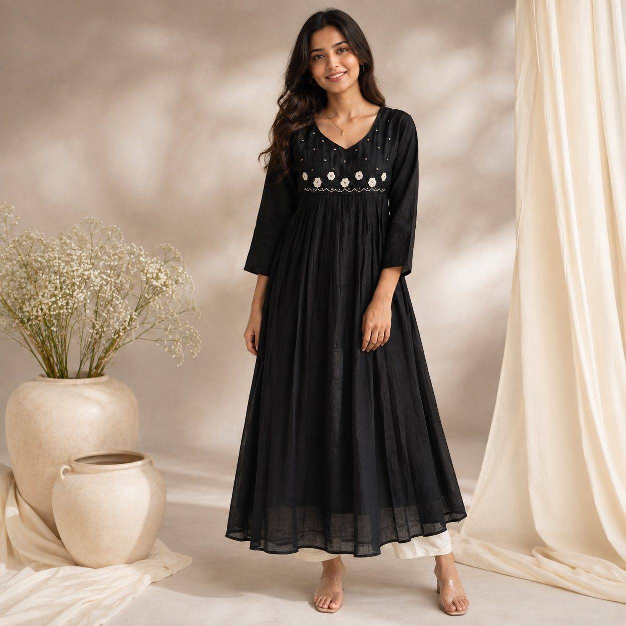 Black A-line two piece kurta set featuring delicate white floral embroidery