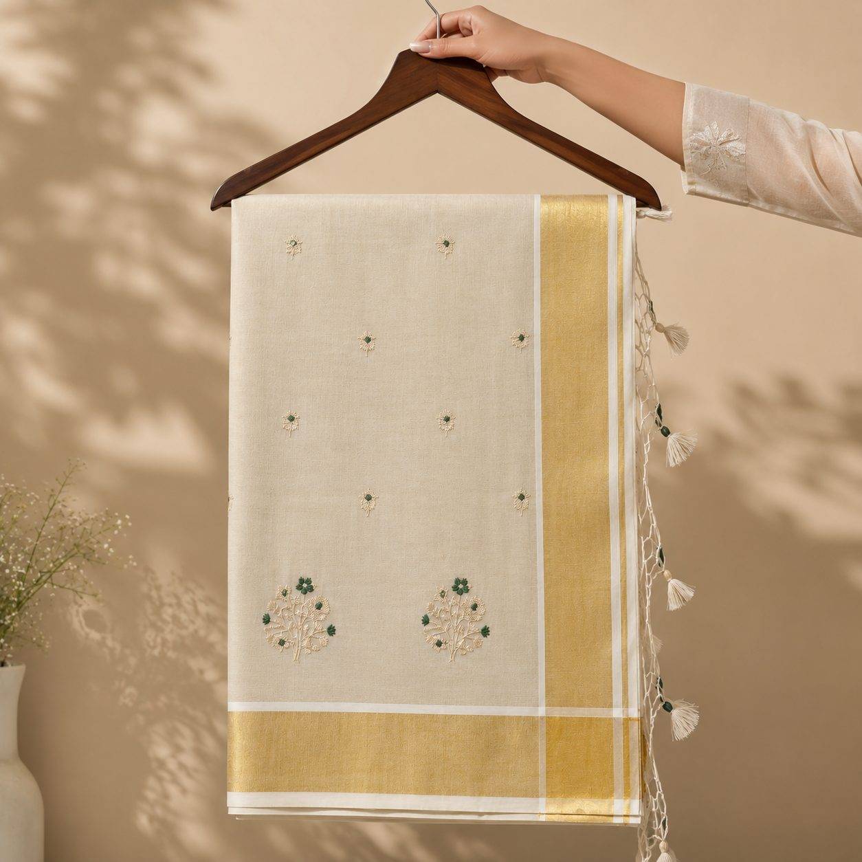 Tissue Kerala Kasavu Saree with Floral Embroidery Bunch and Tassels